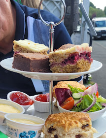 Afternoon tea and cakes on a white plate